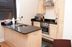 140 Minories Serviced Apartment - Kitchen with all equipments ready for guest stay