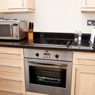 140 Minories Serviced Apartment - Kitchen with all equipments ready for guest stay