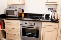 140 Minories Serviced Apartment - Kitchen with all equipments ready for guest stay
